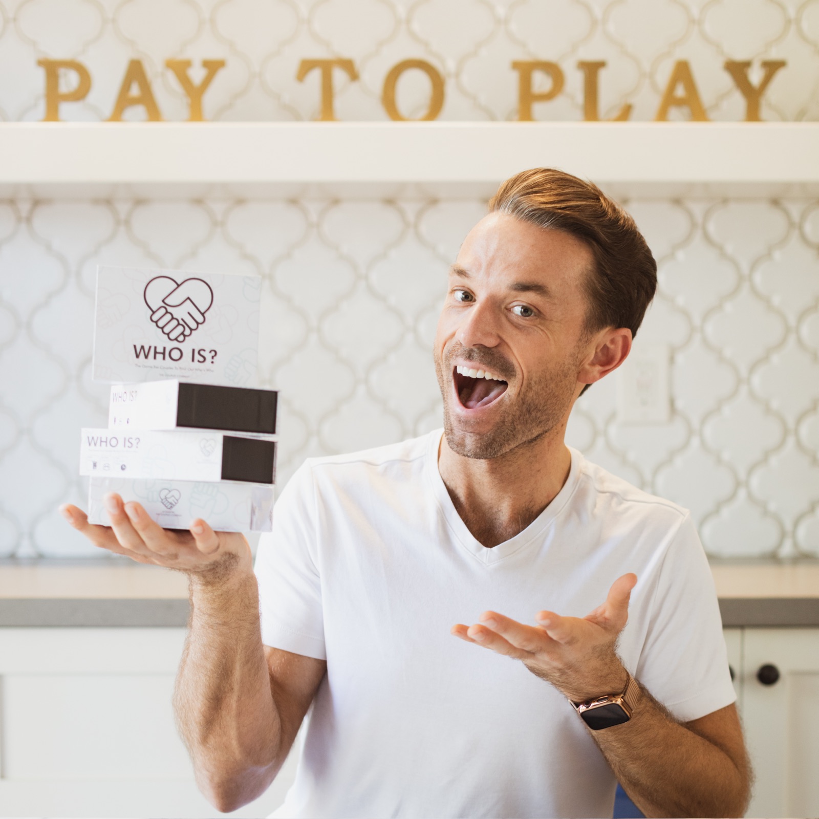 Patrick Frank, founder of The Couples Company, holding a WhoIs? box